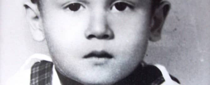 Gustaaf (3) in orphanage clothing